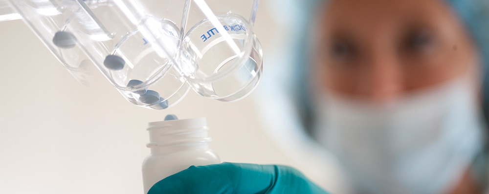 woman packaging pharmaceuticals 